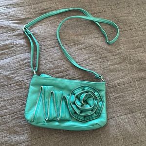 Teal leather purse with zipper rose